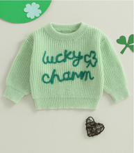 Load image into Gallery viewer, Mint green toddler sweater with embroidered “lucky charm” text and shamrock, St. Patrick’s Day pullover sweater laid flat on white background.
