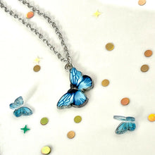 Load image into Gallery viewer, Blue Butterfly In Dolly We Trust Necklace.
