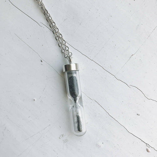 Space Time Hourglass Necklace with Meteorite Dust.