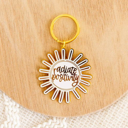 Radiate Positivity Metal Keychain 2.25x2.25 in..