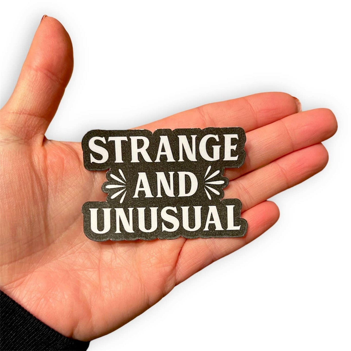 Strange and Unusual Sticker.