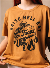 Load image into Gallery viewer, Raise Hell Eat Tacos Unisex Tee.
